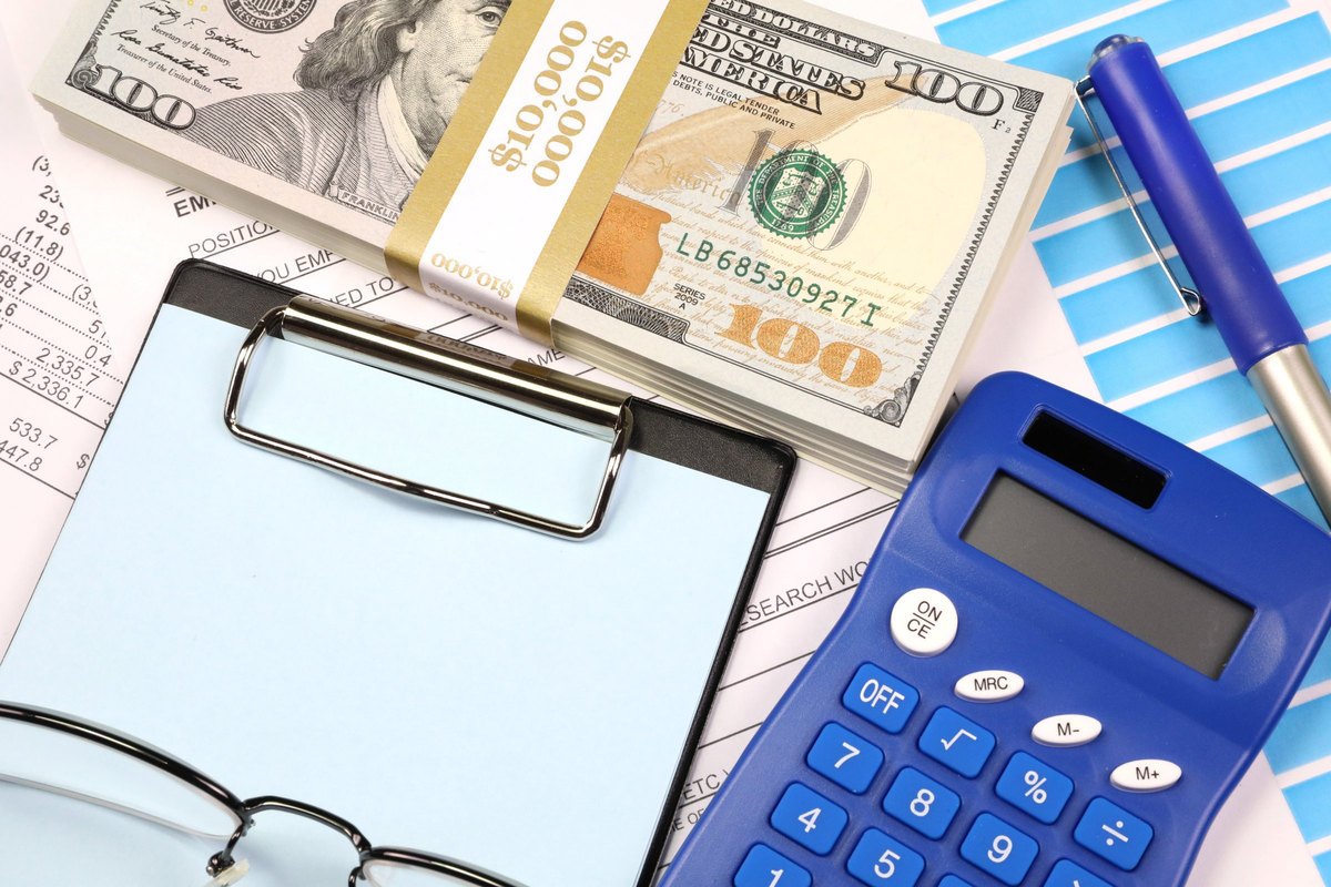 Clipboard with blue paper, dollars and calculator - blank template