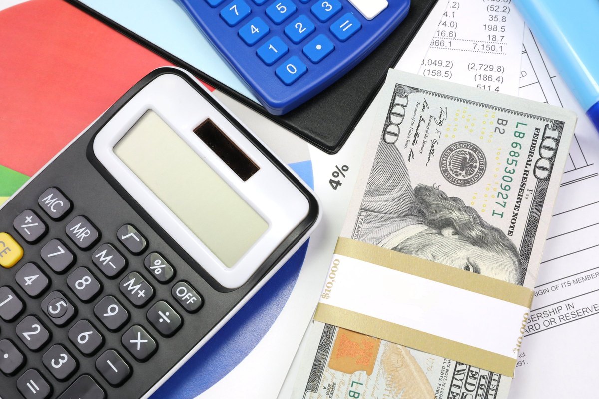 Dollar bills with a blank band, calculators and charts - blank template