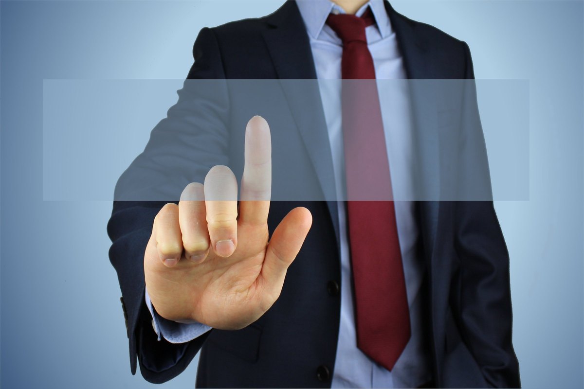 Businessman touching a transparent screen - blank template