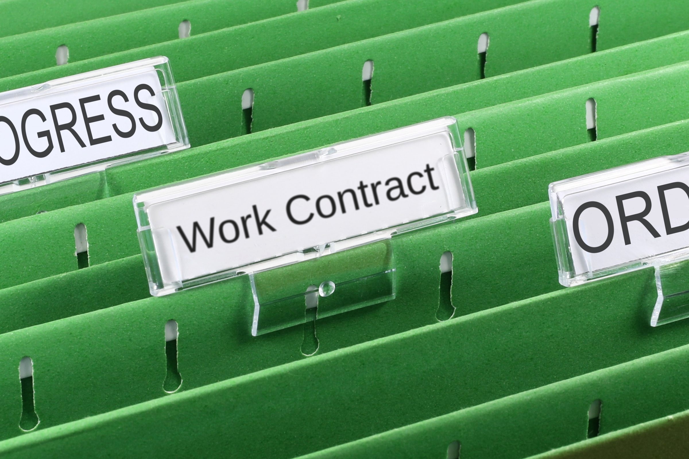 Green suspension file with a blank tab template with the words "Work Contract" printed on the surface