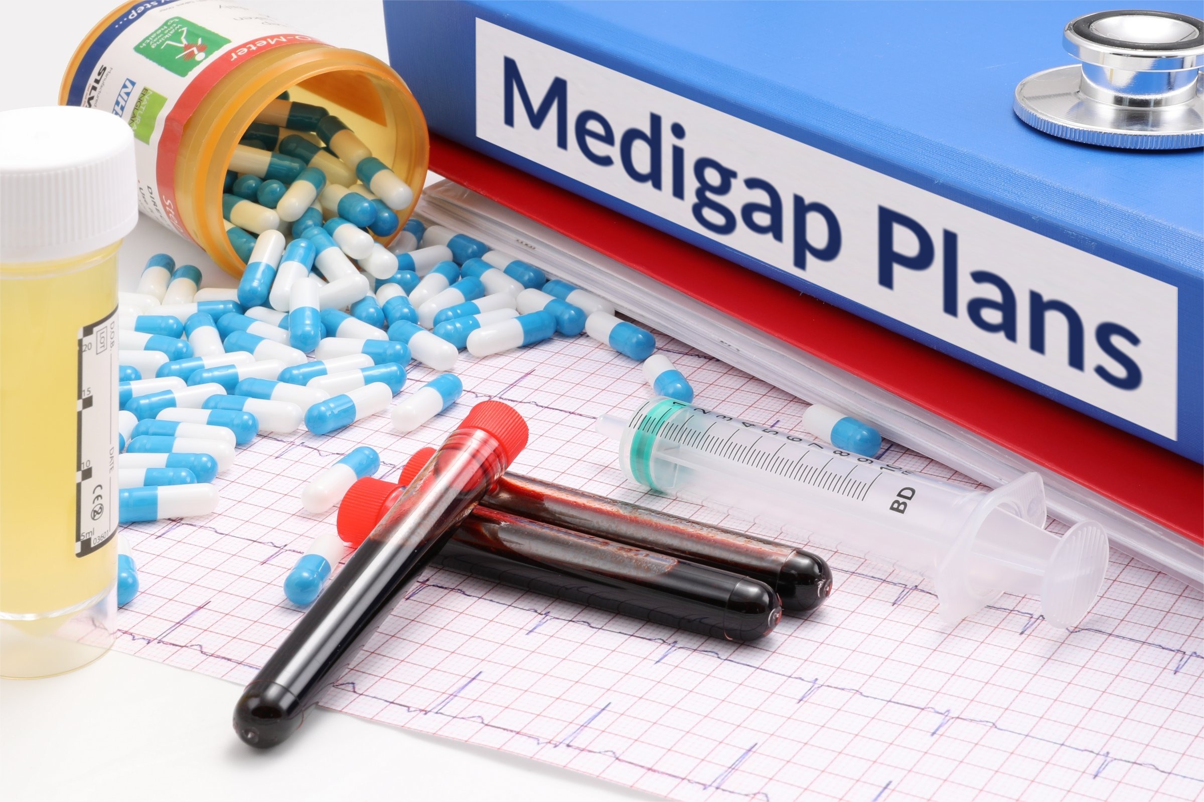 Blue binder with capsules, test tubes and syringe template with the words "Medigap Plans" printed on the surface
