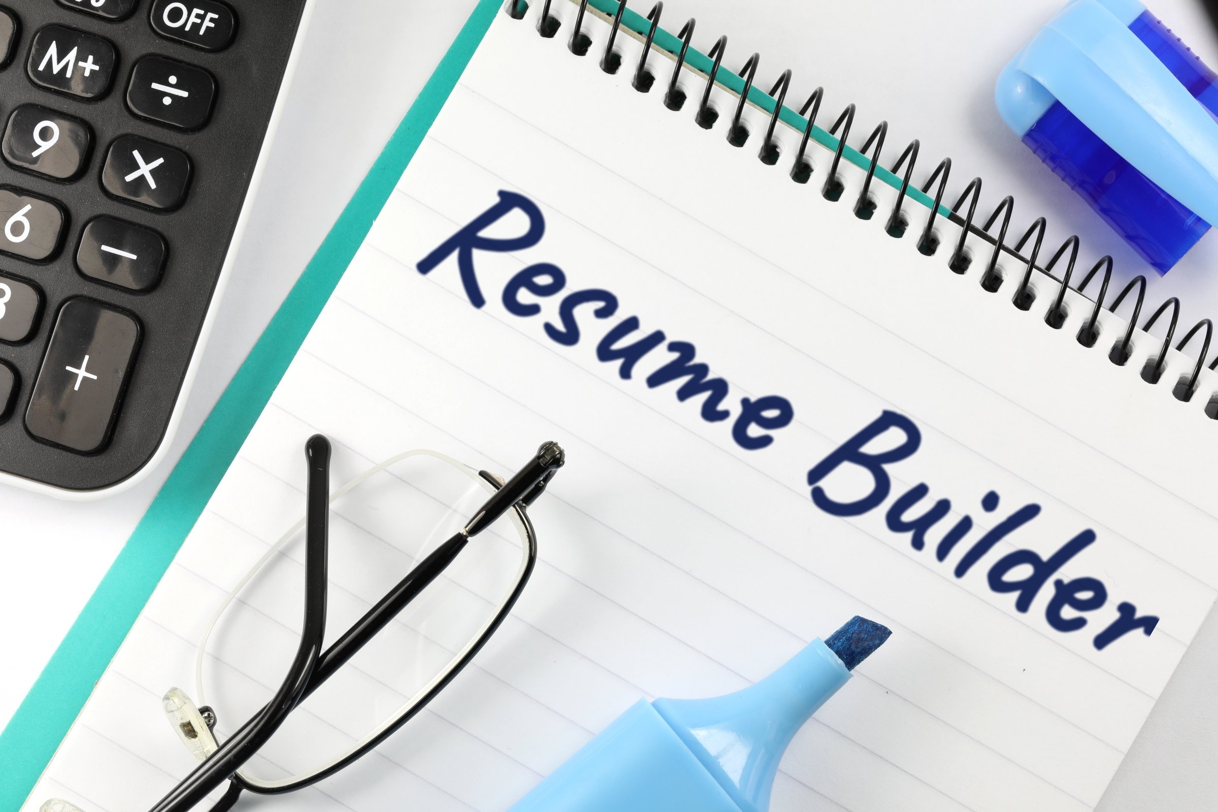 Lined spiral notepad with glasses and highlighter template with the words "Resume Builder" printed on the surface